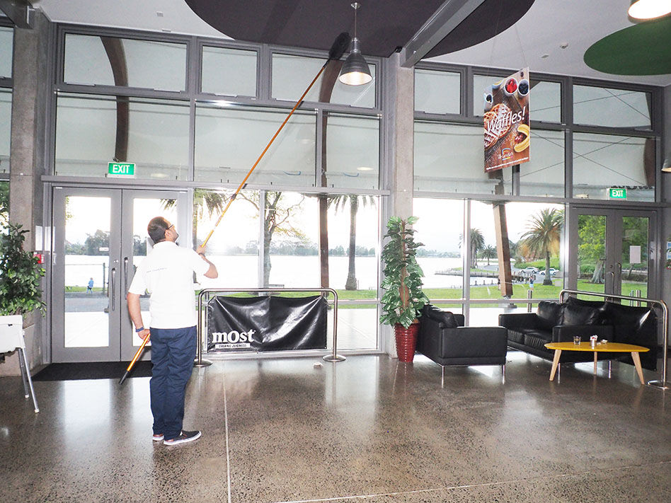 Cleaning the ceiling of a commercial building